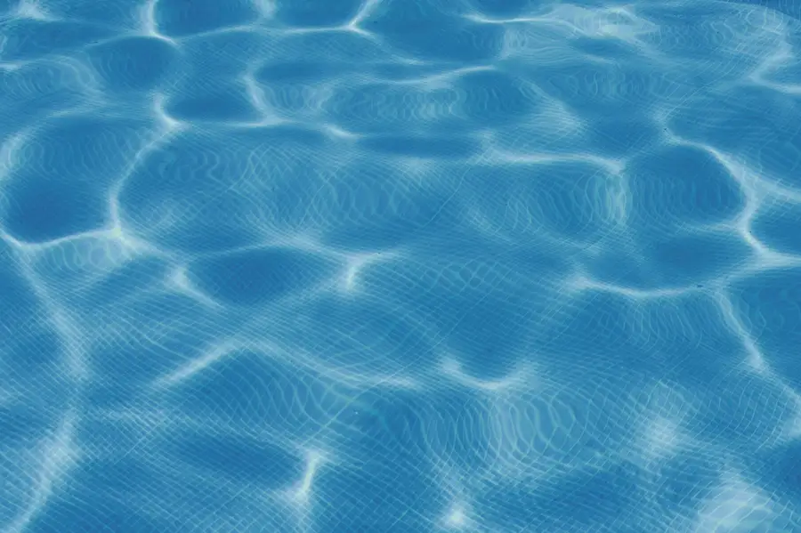 Sunlight breaking across the surface of a swimming pool