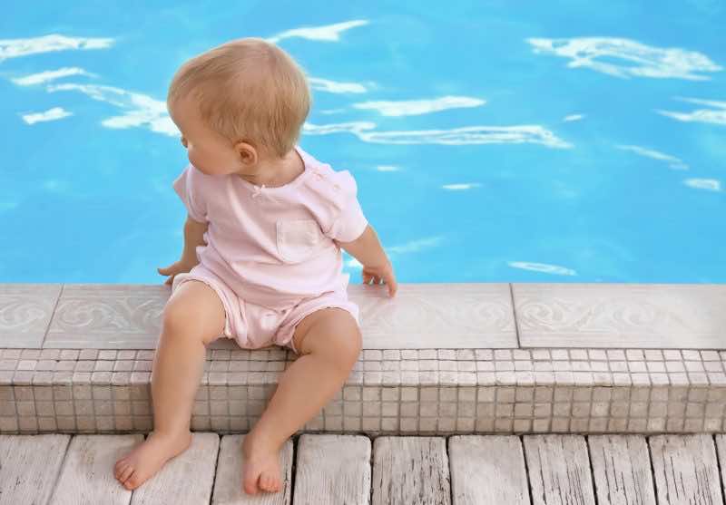 Baby Next to Unsafe Swimming Pool